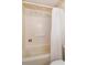 Clean bathroom features a shower with white tile, a toiletry bar and a white shower curtain at 5654 Minute Man Ct, Orlando, FL 32821
