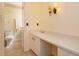 Functional bathroom with neutral color palette, updated lighting and a adjacent toilet and shower at 5654 Minute Man Ct, Orlando, FL 32821