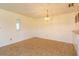Cozy dining area featuring wainscoting and a hanging light fixture, adjacent to an open doorway at 5654 Minute Man Ct, Orlando, FL 32821