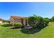 Charming home featuring a lush front yard, terracotta roof, and a welcoming entrance at 5654 Minute Man Ct, Orlando, FL 32821