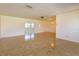 Expansive living space featuring tiled flooring and a seamless flow into the adjacent dining area at 5654 Minute Man Ct, Orlando, FL 32821