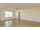 Bright, open living room with neutral walls, tile floors, and a large window filling the space with natural light at 5654 Minute Man Ct, Orlando, FL 32821
