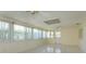 Bright sunroom filled with natural light from multiple windows and neutral color palette at 5654 Minute Man Ct, Orlando, FL 32821