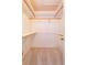 Bright walk-in closet features built in shelves and hanging rods for optimal storage at 5654 Minute Man Ct, Orlando, FL 32821