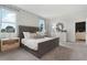 Calm bedroom featuring a comfortable bed, soft color palette, and natural light, offering a peaceful atmosphere for rest at 5909 Cliffbow Loop, Leesburg, FL 34748