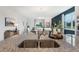 Granite countertop with a stainless steel sink overlooking the open-concept living and dining areas, promoting connectivity at 5909 Cliffbow Loop, Leesburg, FL 34748