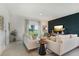 Inviting living room with comfortable seating, stylish decor, and a view to the outside at 5909 Cliffbow Loop, Leesburg, FL 34748