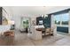 Relaxed living space featuring stylish furniture, neutral accents, and plenty of natural light at 5909 Cliffbow Loop, Leesburg, FL 34748
