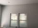 Bright living room featuring fresh paint and new double-paned windows covered in plastic at 63 Lake Wood Cir, Ocala, FL 34482