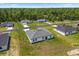 Aerial view of a new home with a large yard, surrounded by a wooded area at 6765 152Nd Lane Rd, Ocala, FL 34473