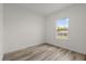 Bright bedroom featuring luxury vinyl plank flooring and a window at 6765 152Nd Lane Rd, Ocala, FL 34473