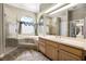 Bathroom featuring a jetted tub, step-up platform, walk-in shower, and lots of natural light at 707 Heritage Ne Dr, Winter Haven, FL 33881