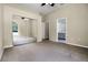 Bedroom with mirrored closet doors and easy access to the bathroom, creating a functional and serene space at 707 Heritage Ne Dr, Winter Haven, FL 33881