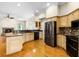 Modern kitchen featuring stainless steel appliances, granite countertops, and a breakfast bar at 707 Heritage Ne Dr, Winter Haven, FL 33881