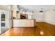 Open kitchen with granite countertops, breakfast bar, and sliding doors at 707 Heritage Ne Dr, Winter Haven, FL 33881