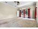 Expansive living area with sliding glass doors leading to the outdoors, offering lots of natural light at 707 Heritage Ne Dr, Winter Haven, FL 33881
