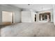 Spacious living room featuring large windows and neutral carpeting, ideal for relaxing and entertaining at 707 Heritage Ne Dr, Winter Haven, FL 33881