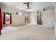 Large living space with ample natural light from arched windows and an easy transition to other rooms at 707 Heritage Ne Dr, Winter Haven, FL 33881