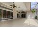 Large covered patio featuring ceiling fans, ample natural light and access to the screened in lanai at 707 Heritage Ne Dr, Winter Haven, FL 33881