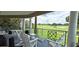 Relax on this condo's spacious balcony with comfortable seating and scenic golf course views at 7220 Westpointe Blvd # 1429, Orlando, FL 32835