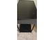 Modern black end table with a tempered glass top and built-in sound system at 7220 Westpointe Blvd # 1429, Orlando, FL 32835