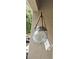 Close-up of a decorative glass lantern hanging on the porch at 7220 Westpointe Blvd # 1429, Orlando, FL 32835