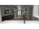 Bright living room with neutral colors, ceiling fan, wall art, and a large window with natural light at 7220 Westpointe Blvd # 1429, Orlando, FL 32835