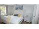 Cozy bedroom features a queen-sized bed, soft bedding, and lots of natural light at 7220 Westpointe Blvd # 1429, Orlando, FL 32835