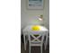 Bright home office space featuring a white desk with a yellow lamp and modern desk chair at 7220 Westpointe Blvd # 1429, Orlando, FL 32835