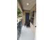 Cozy patio with outdoor seating, a decorative lantern, and natural light at 7220 Westpointe Blvd # 1429, Orlando, FL 32835