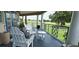 Relaxing porch view with white Adirondack chairs overlooking the lush golf course at 7220 Westpointe Blvd # 1429, Orlando, FL 32835