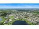 An elevated shot displays a beautiful, planned community complete with ponds and lush greenery at 7409 Fairgrove Ave, Windermere, FL 34786