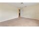 Bedroom featuring neutral walls and carpet with a hallway entrance at 7409 Fairgrove Ave, Windermere, FL 34786