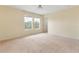 Bright and spacious bedroom featuring natural light, neutral walls and carpet at 7409 Fairgrove Ave, Windermere, FL 34786