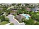 This aerial view highlights the inviting community pool and amenity center, surrounded by lush landscaping at 7409 Fairgrove Ave, Windermere, FL 34786