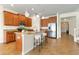 Well-lit kitchen featuring stainless steel appliances, granite countertops, and a central island with seating at 7409 Fairgrove Ave, Windermere, FL 34786
