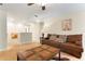 Cozy upstairs living area featuring a plush brown sofa and stylish decor at 7409 Fairgrove Ave, Windermere, FL 34786