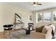 Bright living room with neutral palette, stylish furnishings, and ample natural light streaming through large windows at 7409 Fairgrove Ave, Windermere, FL 34786