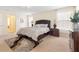 Comfortable primary bedroom suite with a large bed and bright windows at 7409 Fairgrove Ave, Windermere, FL 34786