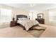 Serene bedroom with a plush bed, matching furniture, and soft natural light at 7409 Fairgrove Ave, Windermere, FL 34786