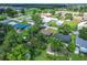 Aerial view of neighborhood, and Lawton Baptist Church with green spaces at 91 High St, Winter Haven, FL 33880
