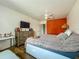 Bedroom with wood-look floor, TV, and chest of drawers at 91 High St, Winter Haven, FL 33880