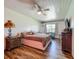 Bedroom features a wood-look floor and natural light at 91 High St, Winter Haven, FL 33880