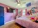 Cozy bedroom with a pink theme and vinyl flooring at 91 High St, Winter Haven, FL 33880