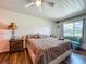 Bright bedroom with wood-look floors and window at 91 High St, Winter Haven, FL 33880