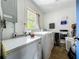 Practical laundry room with modern washer and dryer, plus storage solutions at 91 High St, Winter Haven, FL 33880