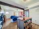 Open concept living room featuring an eat-in kitchen, hardwood floors, and comfortable modern furniture at 91 High St, Winter Haven, FL 33880