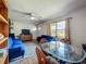 Bright and airy living room with wood floors, a ceiling fan and large window allowing for natural light at 91 High St, Winter Haven, FL 33880