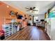 Office area with wood-look floors, bright paint, lots of windows, and ceiling fan at 91 High St, Winter Haven, FL 33880