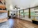 Spacious office area with wood-look floors, lots of windows, and ceiling fan at 91 High St, Winter Haven, FL 33880